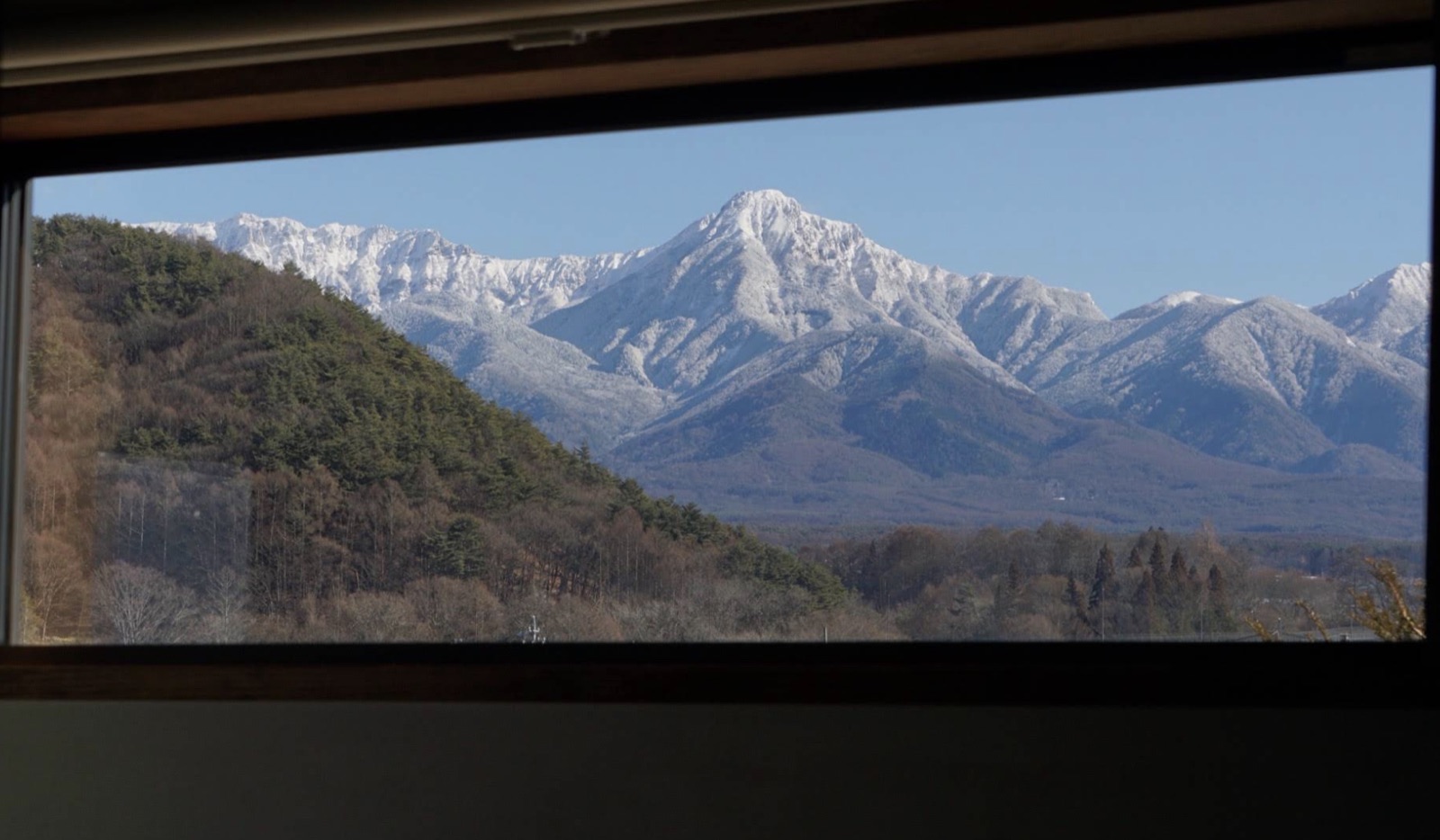 The snowy peaks seen from a window of the house